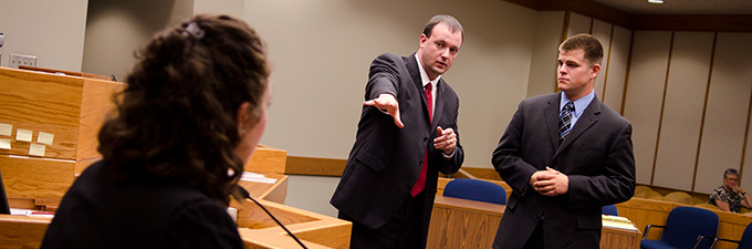 Mock trial student in courtroom